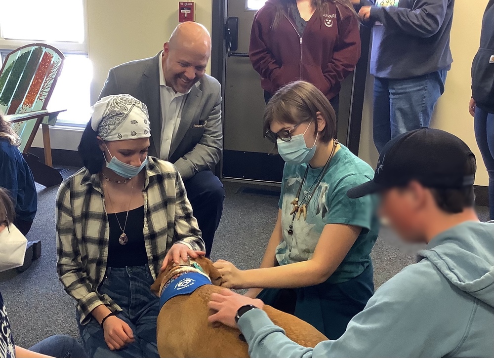 Students and Principal with therapy dogs