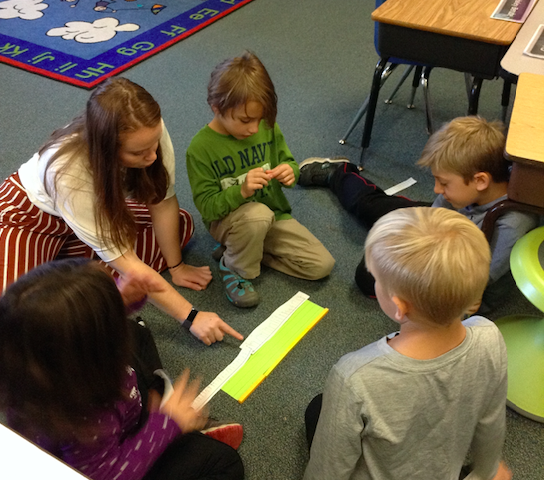 Ms. Tarrio works with 2nd grade students to measure